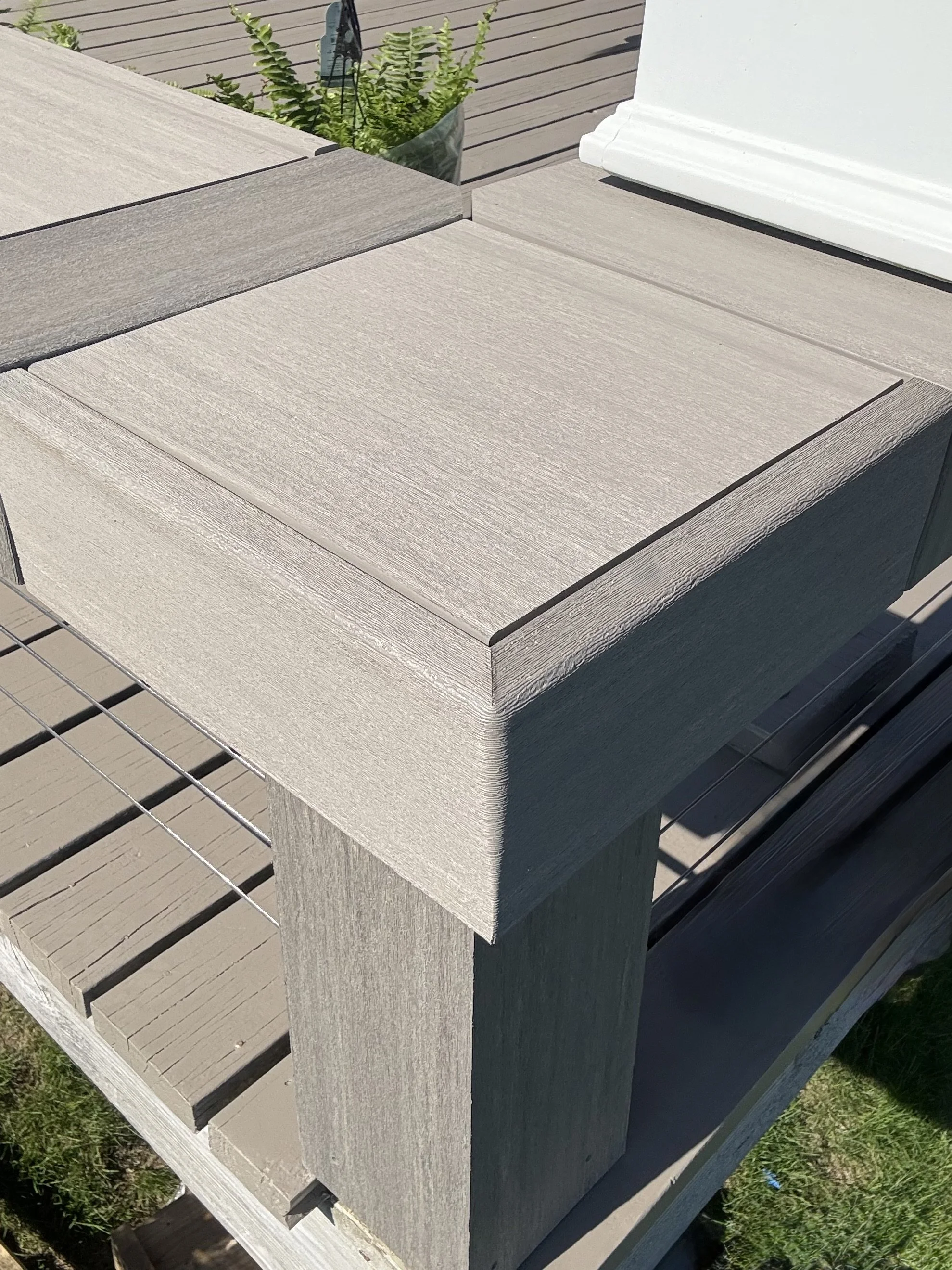 Custom bent and folded timber tech coastline vintage collection boards and trim to recreate a bench on a deck on block island RI