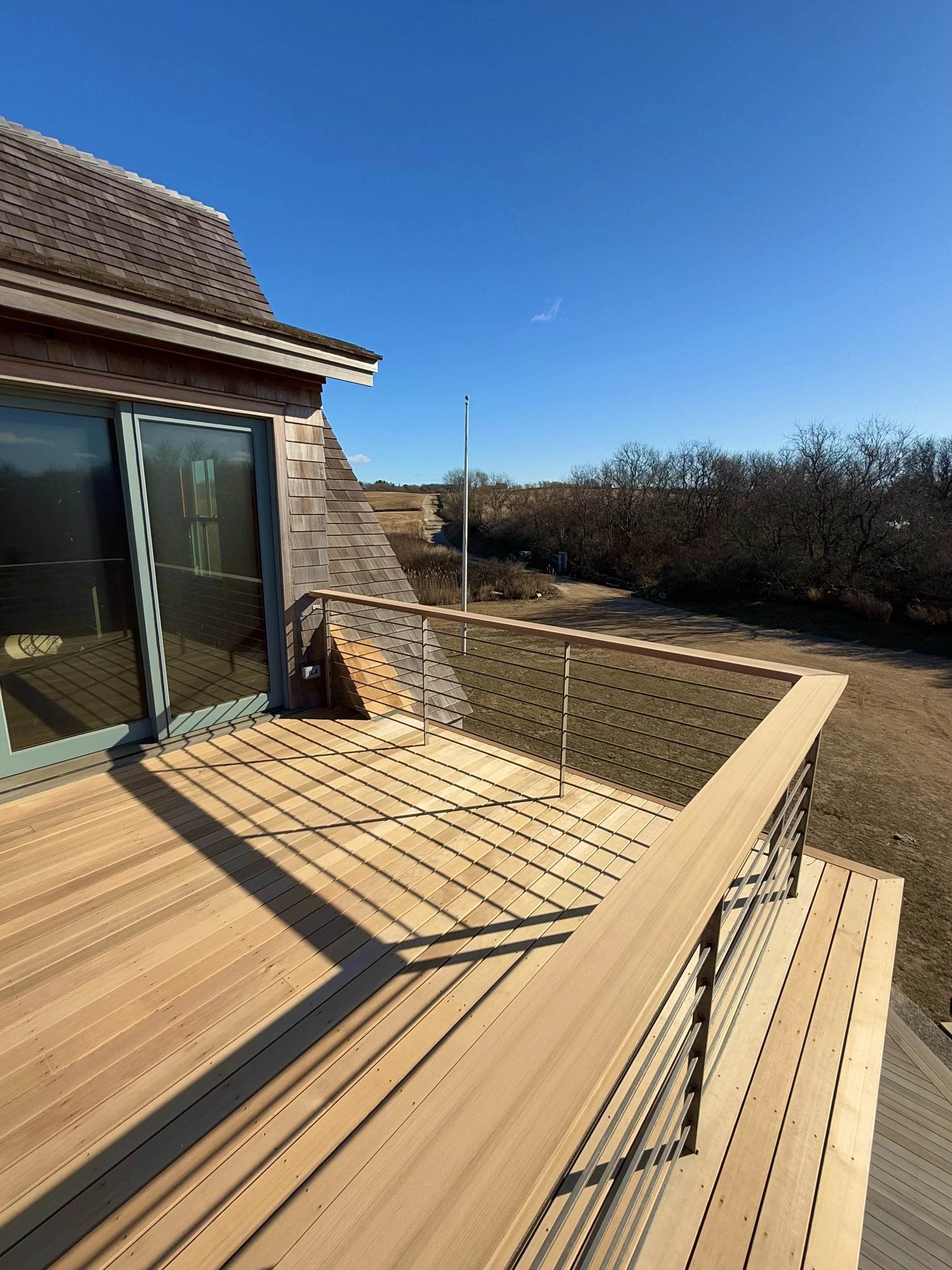 Western red cedar stainless fastened deck with stainless steel railings and cedar drink rails on block island RI corn neck road 