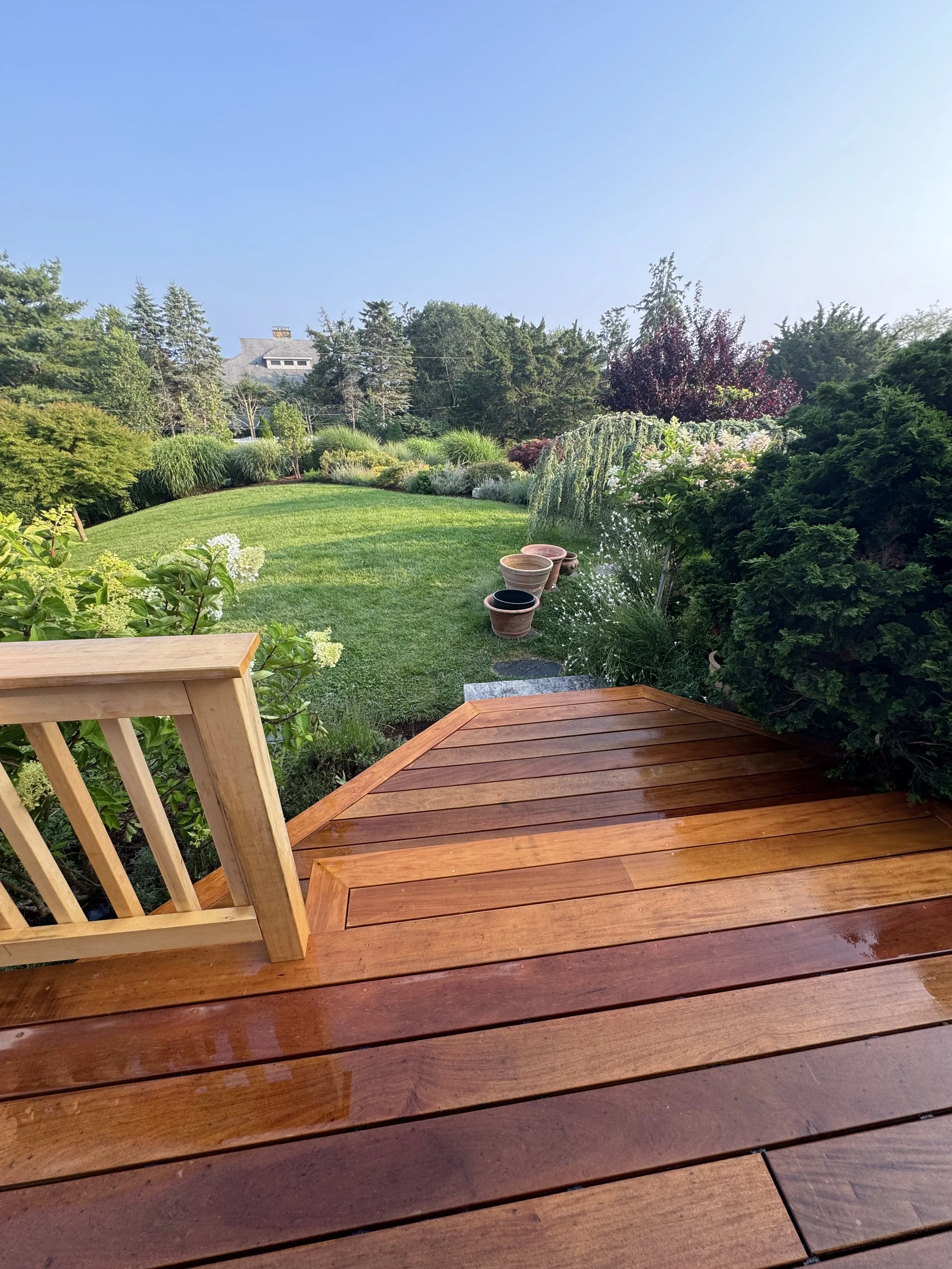 Custom Garapa deck stairs with Alaskan Yellow Cedar custom rails in watch hill RI