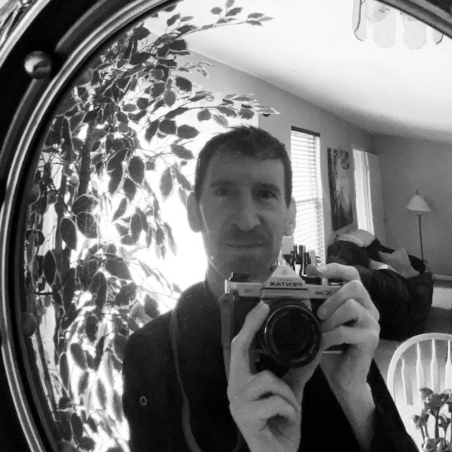 self-portrait through a convex mirror