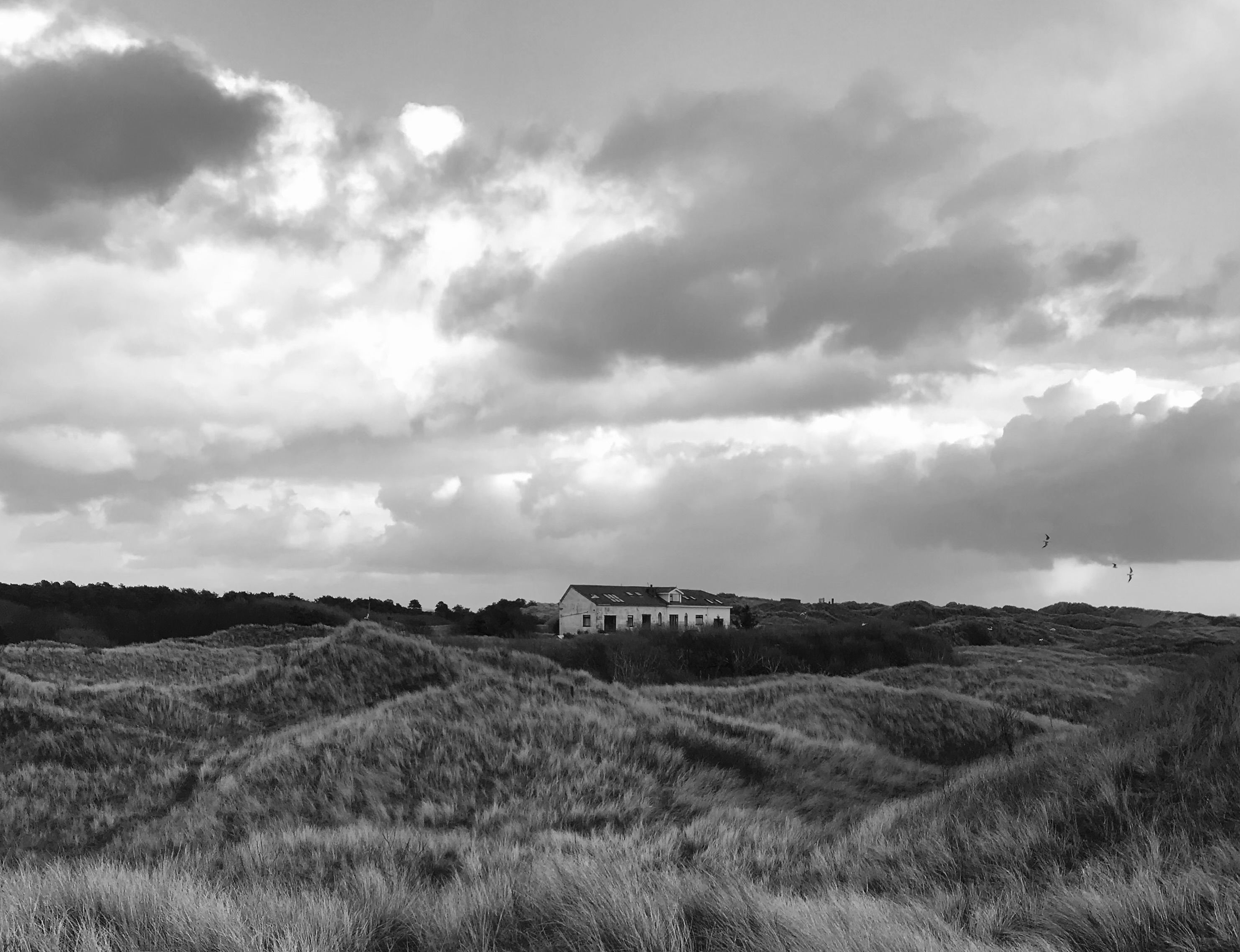 Isolated country home, storm clouds