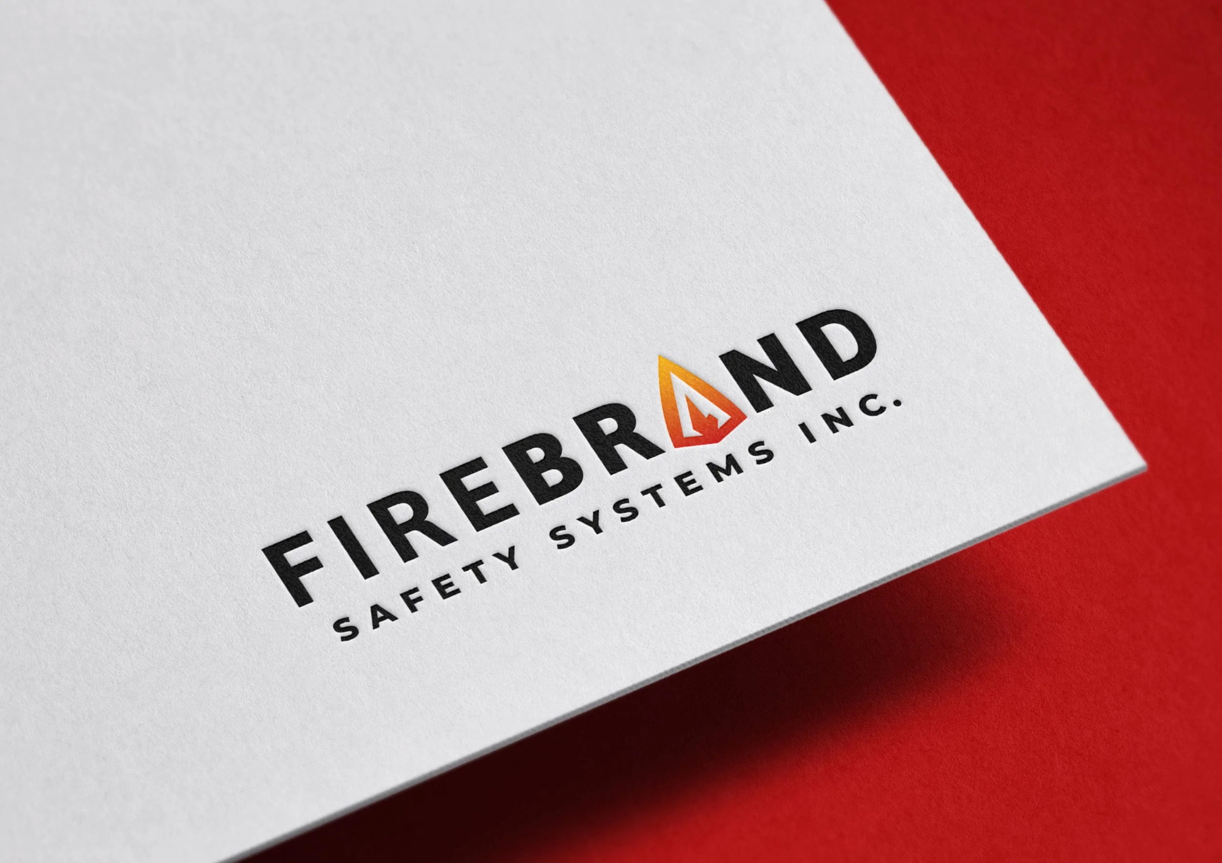 Firebrand Safety Systems logo depicted on paper print hovering over a red background