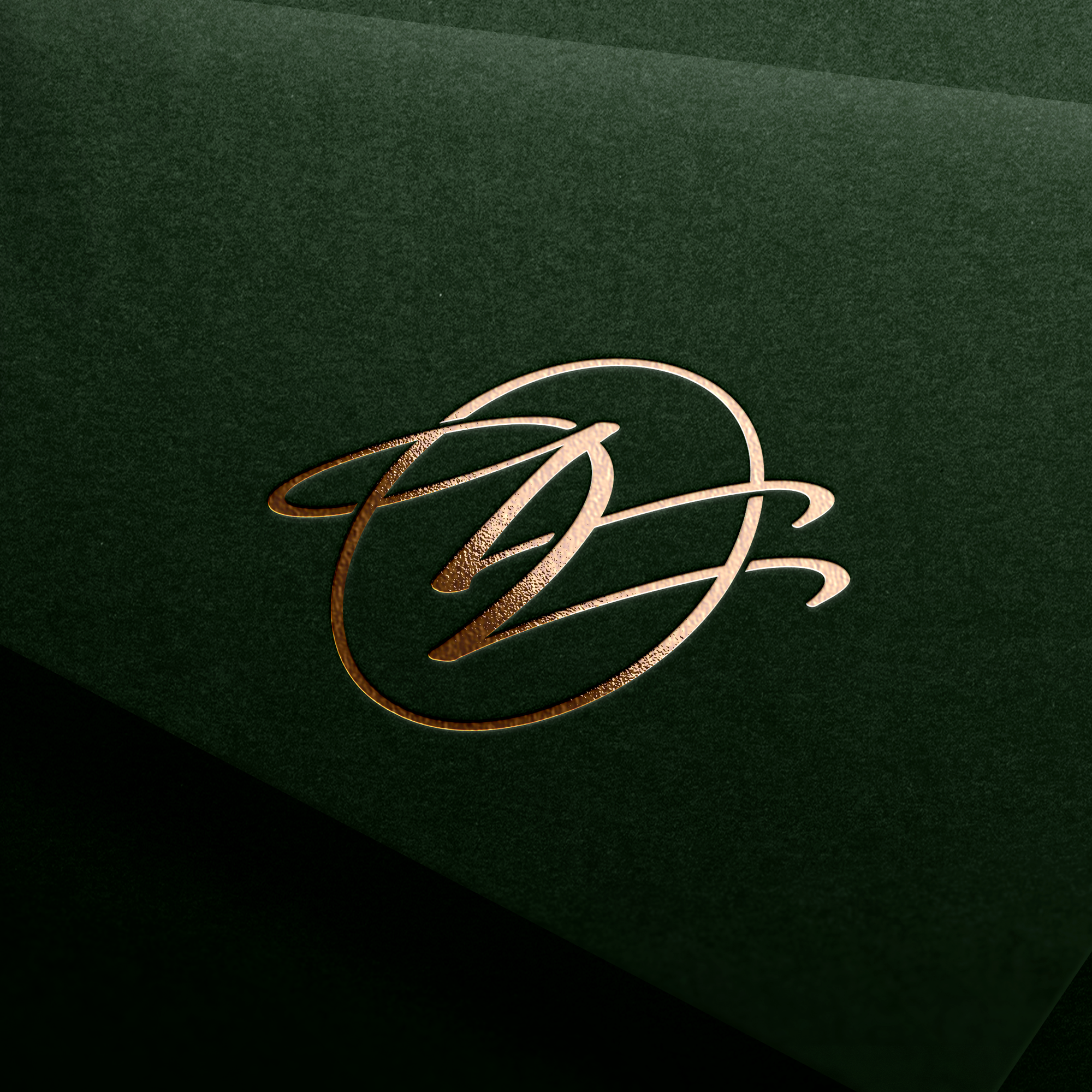 NV monogram stamped in gold foil on green textured paper