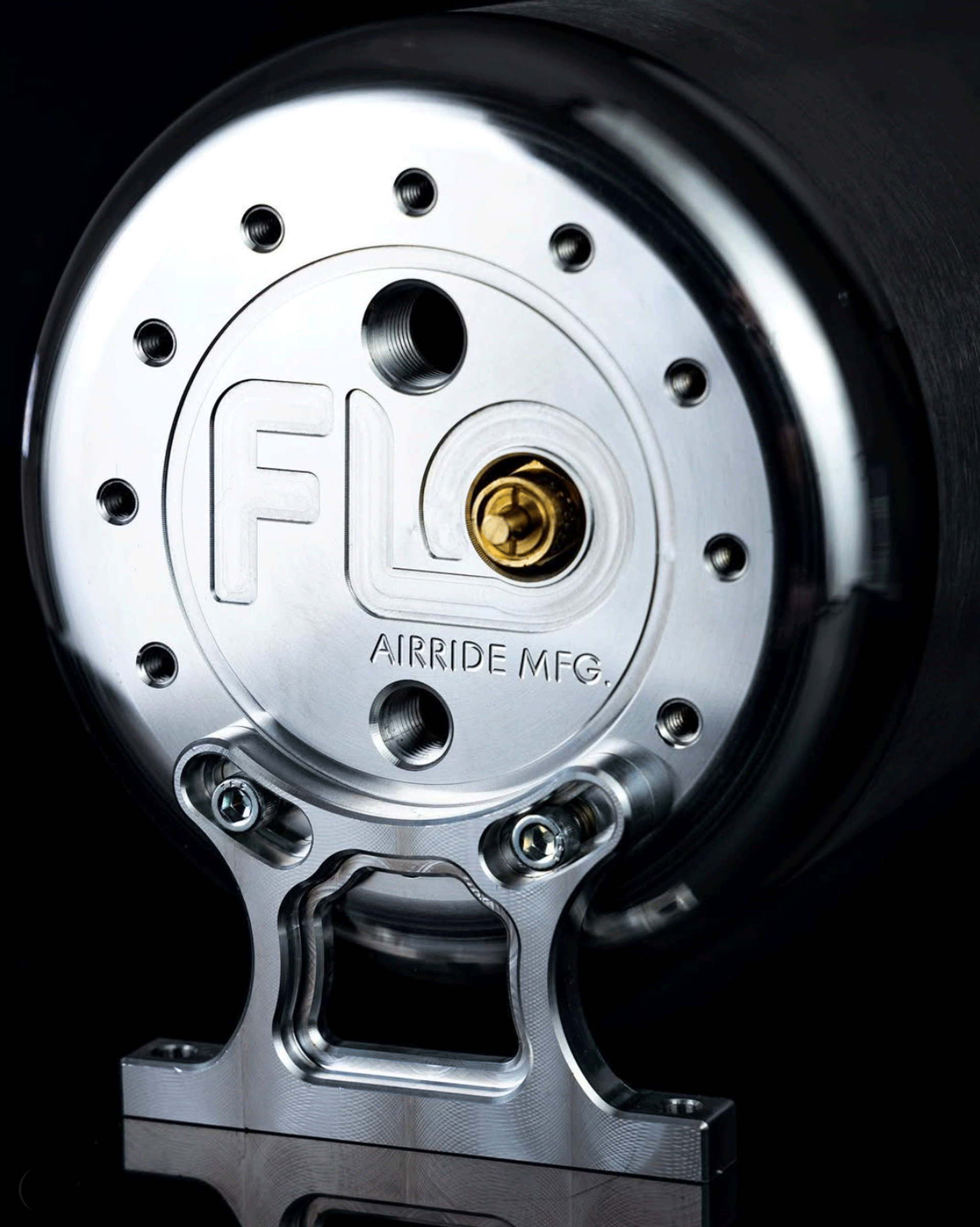Detailed image of billet aluminum air tank end cap with CNC milled FLO Airride Mfg. logo
