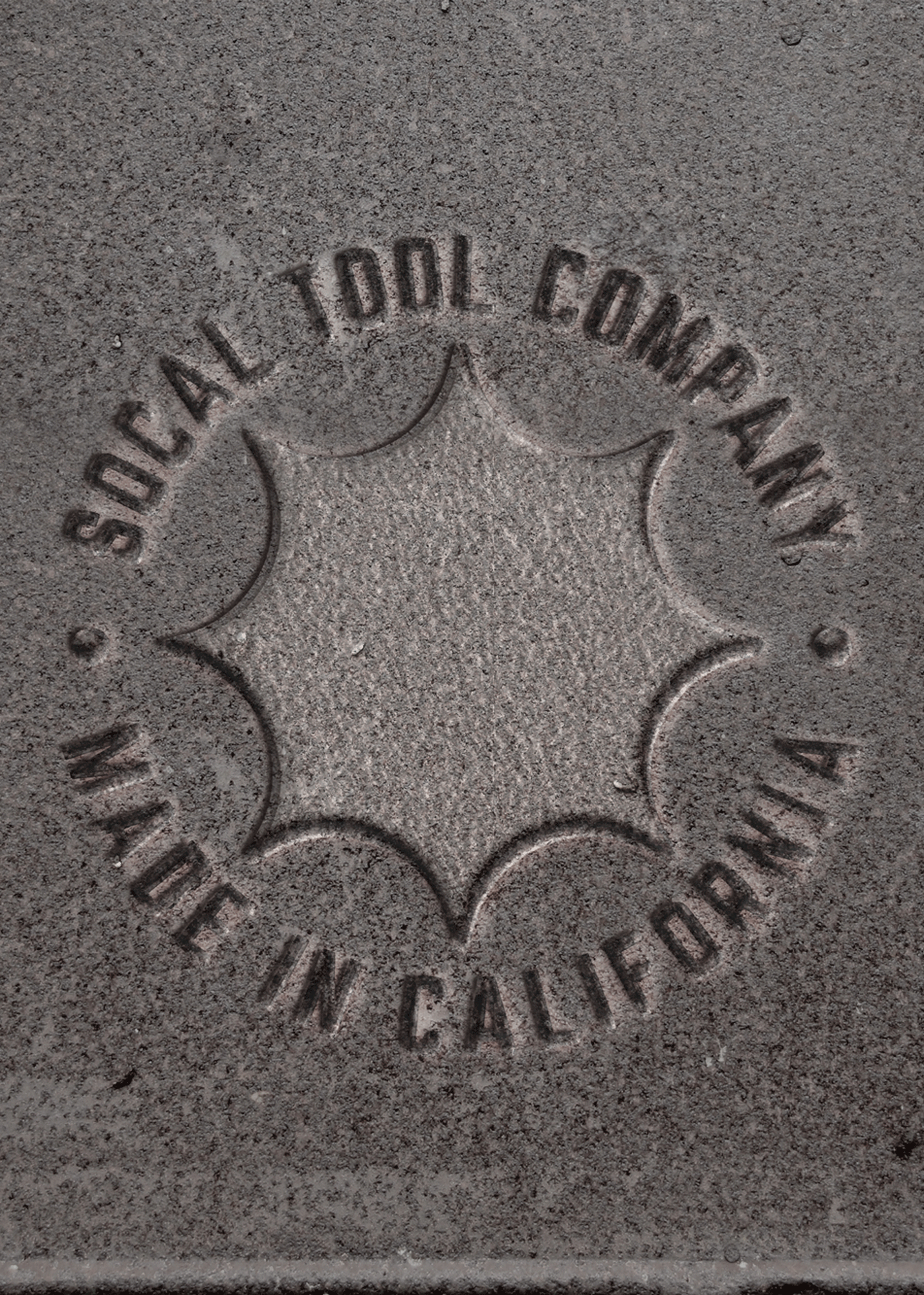Detailed image of SoCal Tool's "Made In California" badge stamped in iron