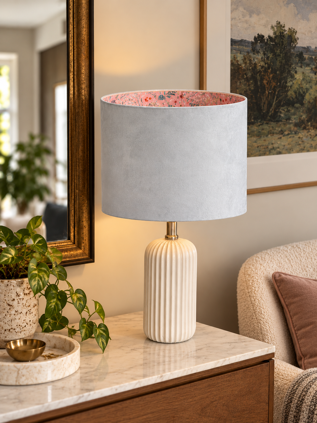 Cozy Marble Console with Floral Lamp.png