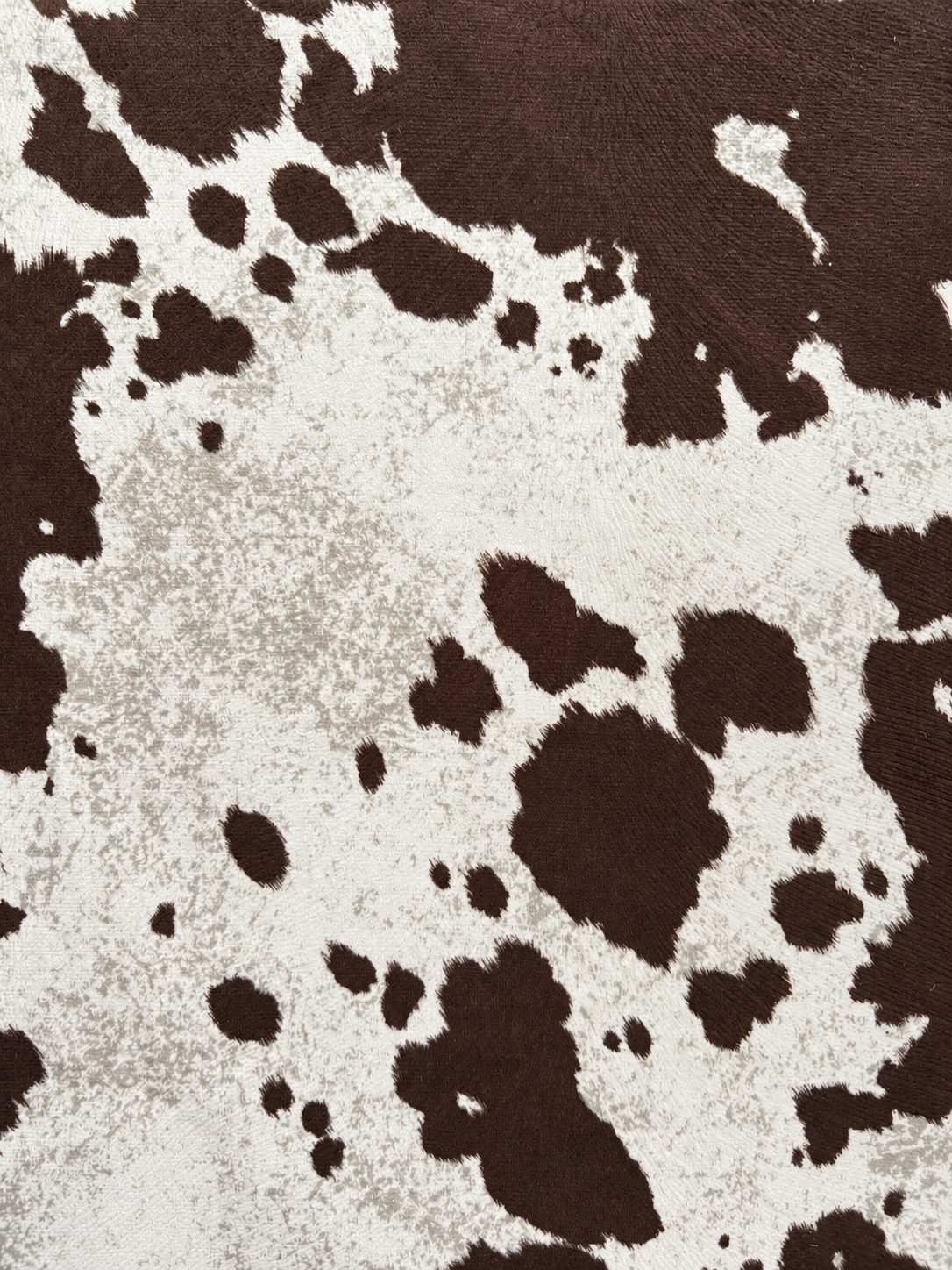 Evenly lit cow-print suede.png