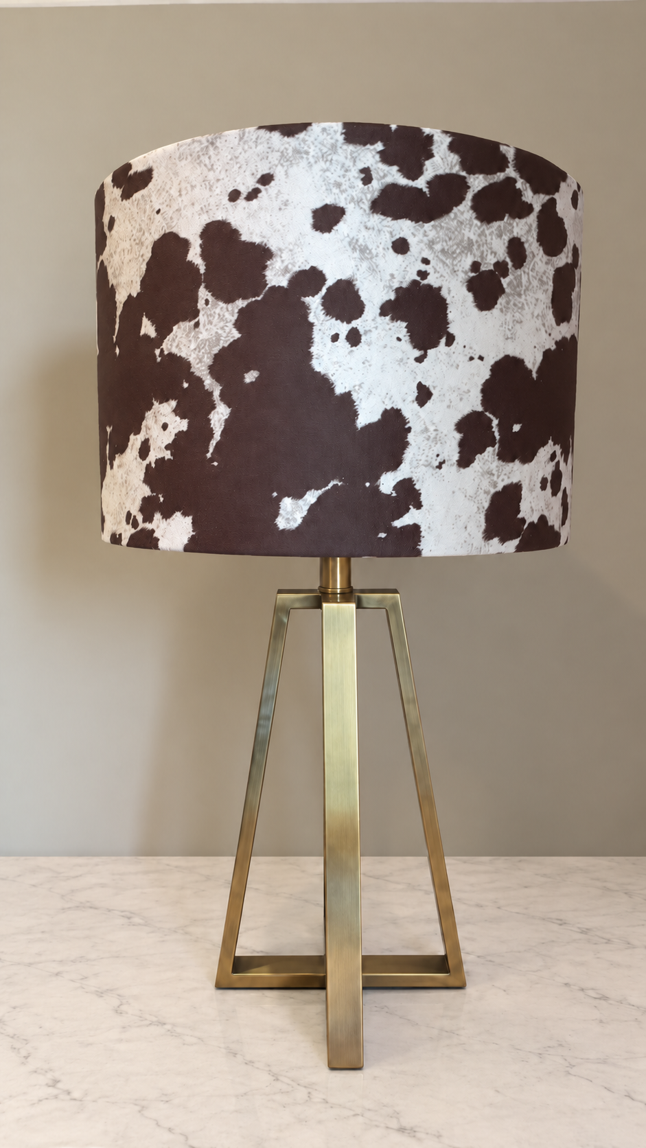 Unlit cow print lamp on marble.png