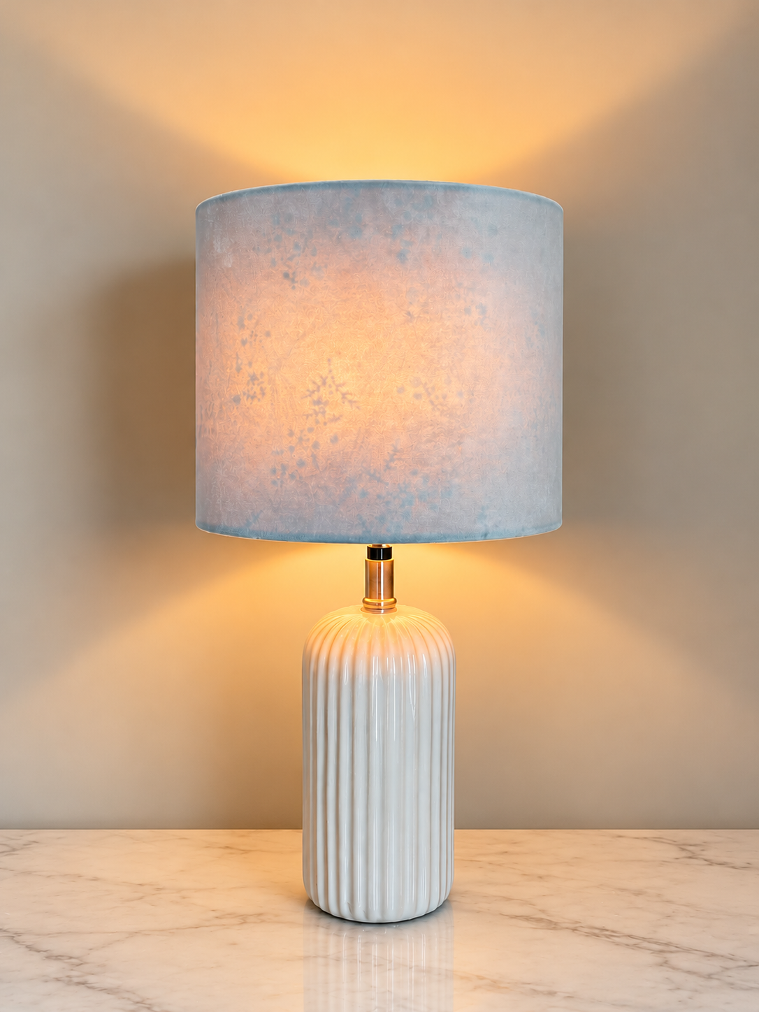 Warmly Lit Ribbed Ceramic Table Lamp.png