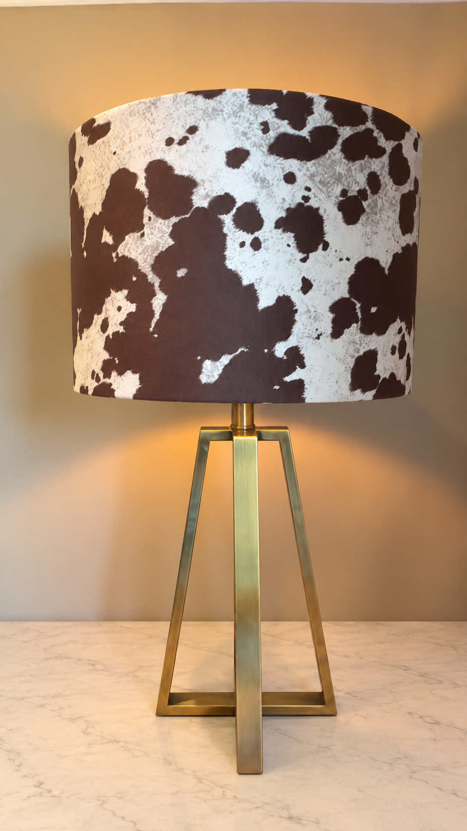Cow print lamp on pale marble.png