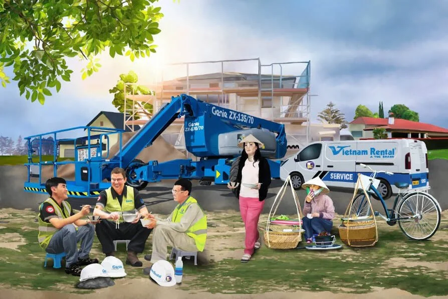 Construction workers having a meal with a Vietnam Rental service van and a bicycle in front of a house under construction.