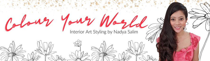 Banner for 'Colour Your World' interior art styling by Nadya Salim, featuring a woman with long black hair in a pink dress, with black and white floral illustrations and golden speckles.