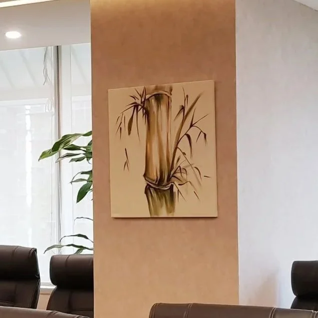 Painting of bamboo stalks on a wall in a modern interior
