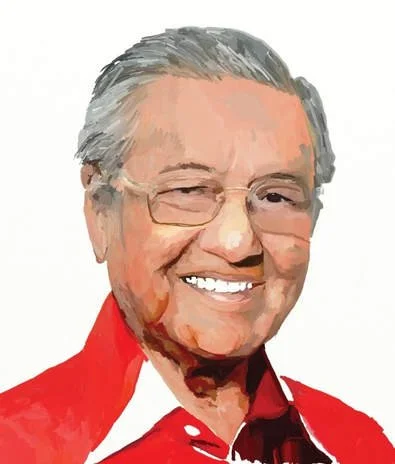 A smiling man with gray hair and glasses, wearing a red shirt.