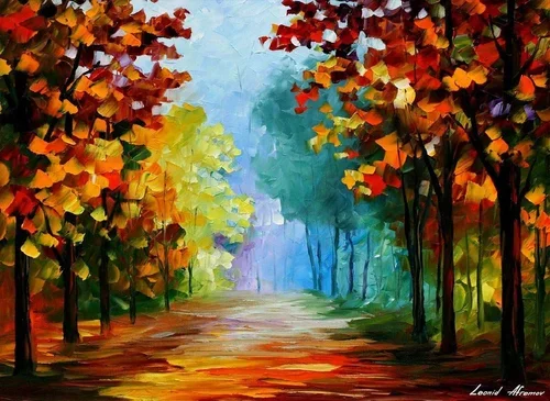 Colorful autumn trees lining a dirt path in a forest
