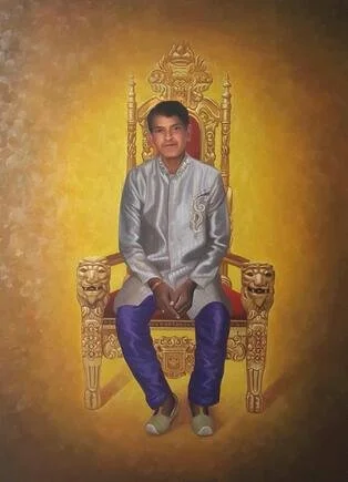 A young boy sitting on an ornate golden throne with a yellow background.