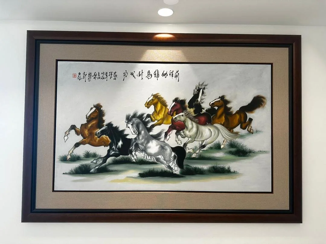 Painting of seven horses running on grass, with some in black, white, brown, red, and yellow colors, and Chinese calligraphy at the top.