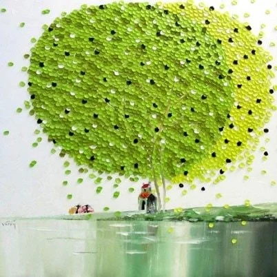 A large green tree with many yellow and black dots on its leaves, standing next to a body of water.