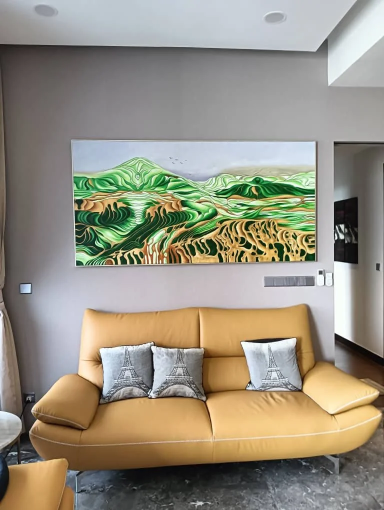 Living room with a yellow sofa, decorative pillows with Eiffel Tower designs, and a colorful landscape painting on the wall.