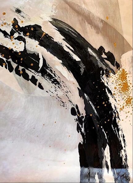 Abstract black and gold paint splatter on a white and beige canvas