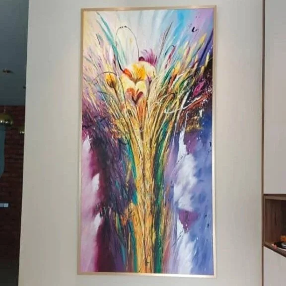 An abstract colorful painting with vibrant brushstrokes and splashes of paint on canvas.