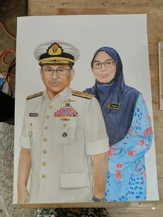 A man in a white military uniform with medals and a woman in a blue hijab and patterned dress standing together.
