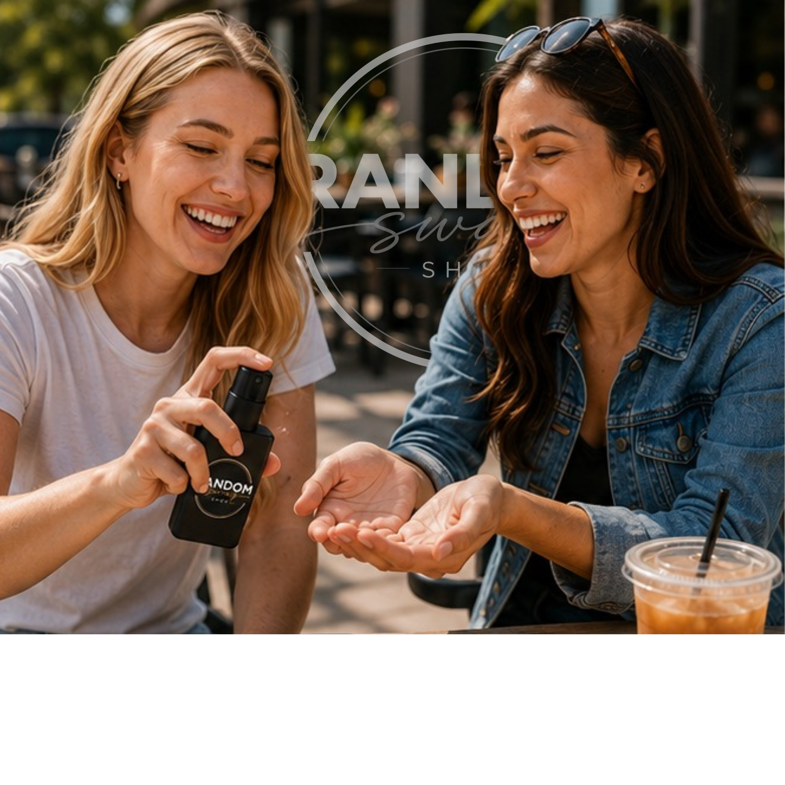 Two women laughing together at an outdoor café while one uses a branded black pocket hand sanitizer spray in the other woman’s open hand