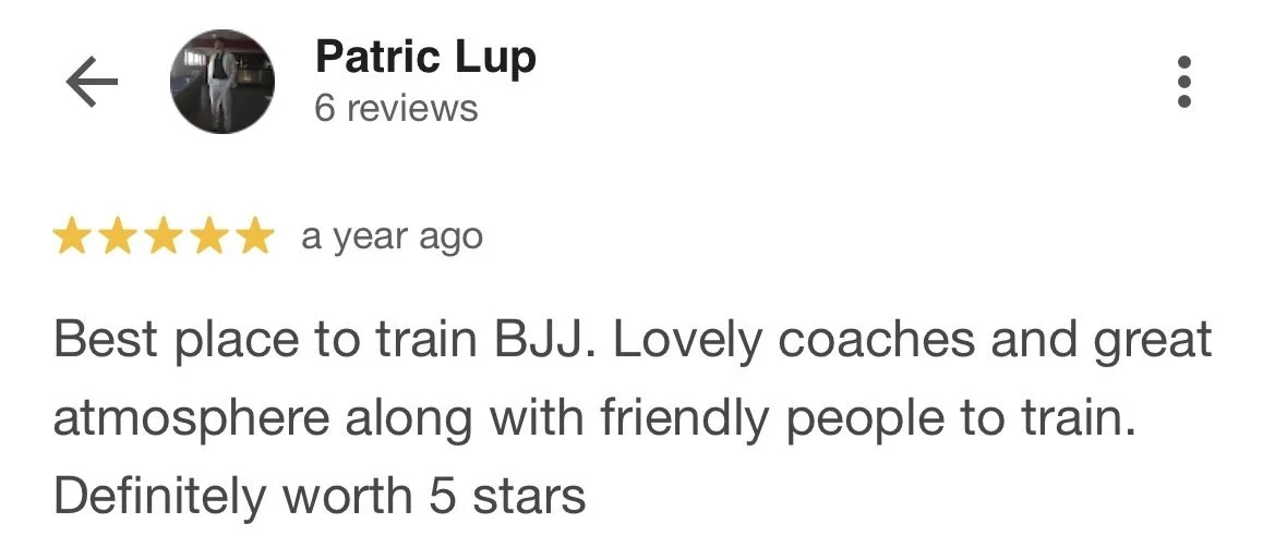 Screenshot of a Google review for a BJJ training center, with a five-star rating and positive comments about the coaches, atmosphere, and training experience.