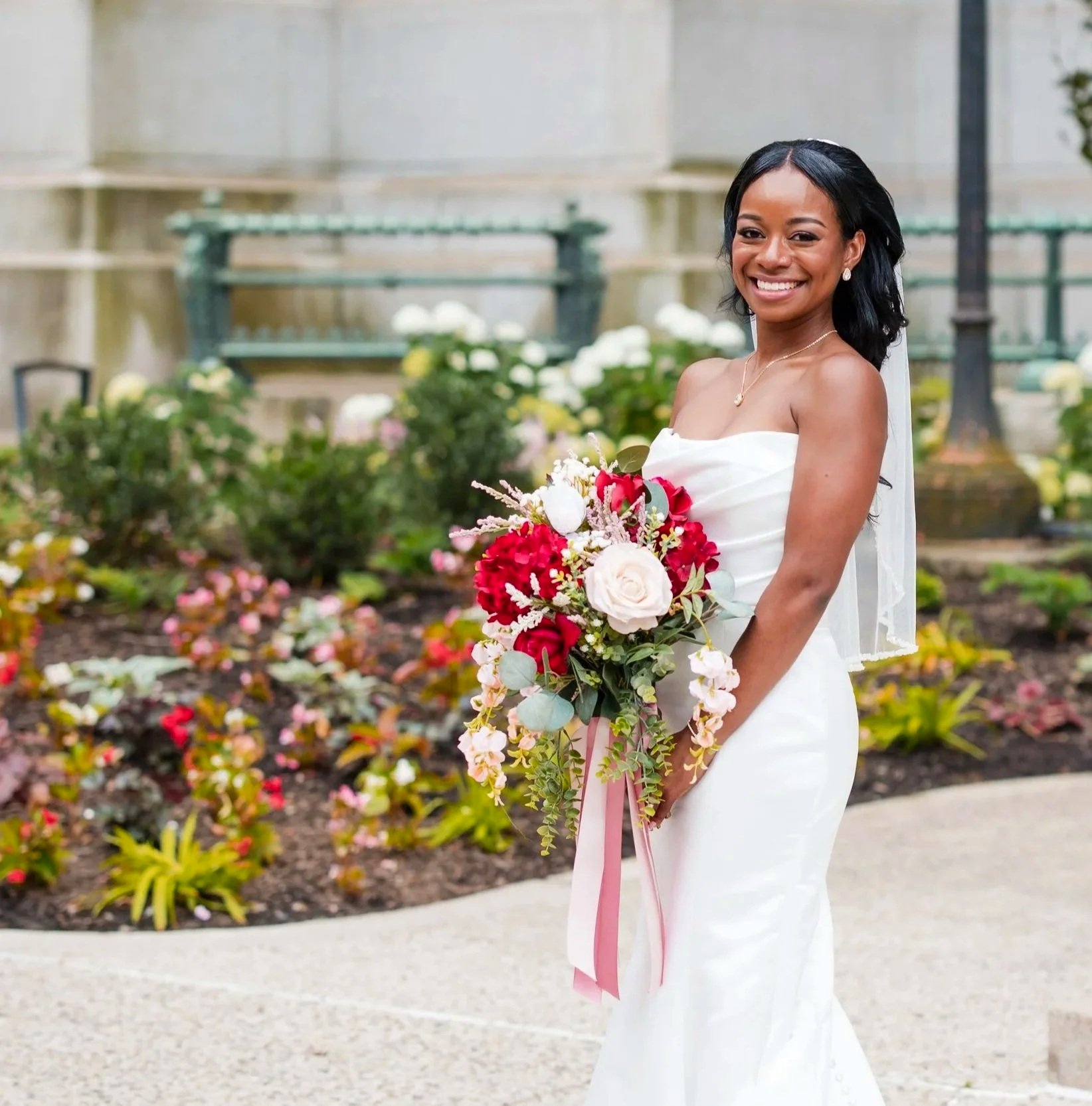 a smiling Dominican bride with bridal makeup on