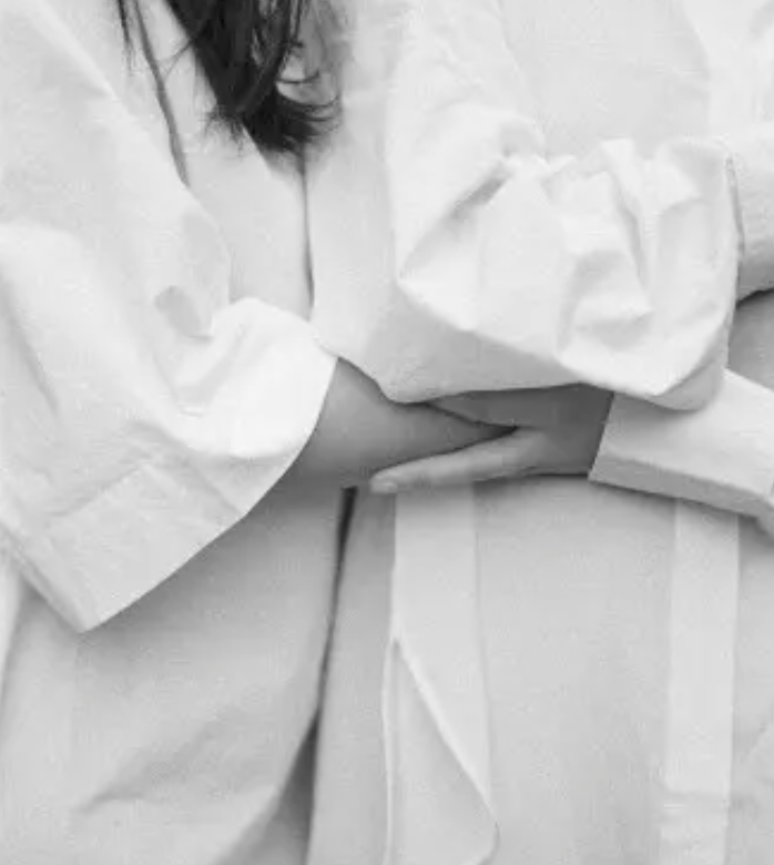 Black and white photo of a couple embracing.