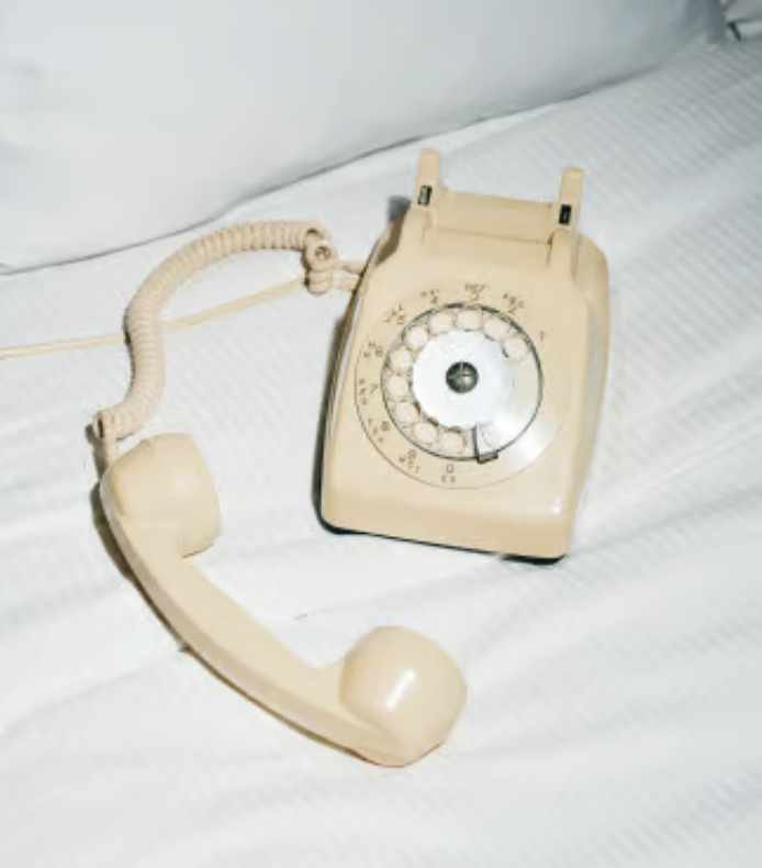 Vintage rotary telephone on a light surface