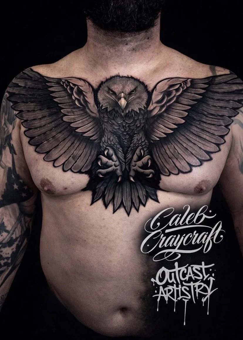 Tattoo of a detailed black and gray eagle with outstretched wings on a man's chest, with text reading 'Caleb Craycraft Outcast Artistry' below.