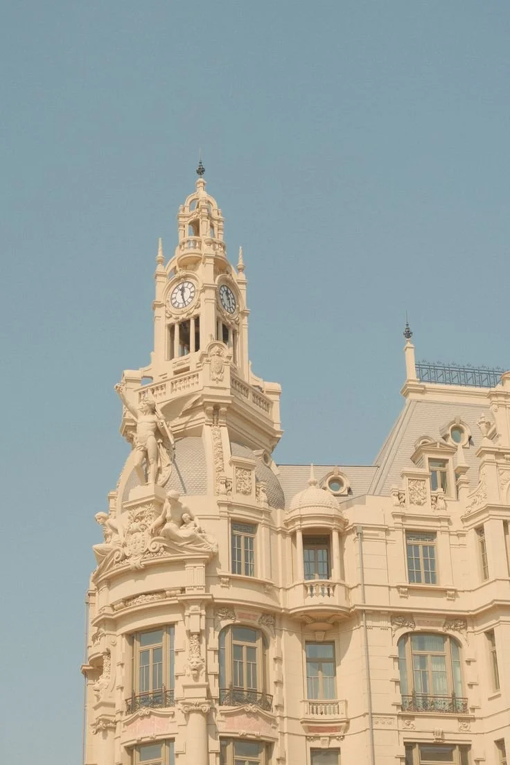 A historic building with a clock tower and ornate architectural details.