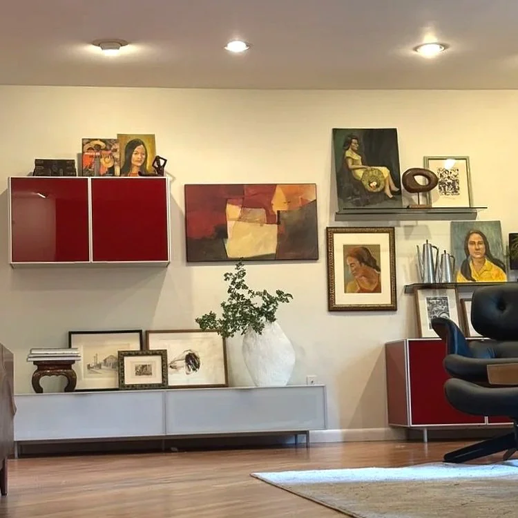 After: Those changes allowed us to focus on the gorgeous Italian cabinetry, but the spacing created a problem. The unusual layout gave us a great opportunity to get creative with her artwork collection, and we added vases and branches for texture and