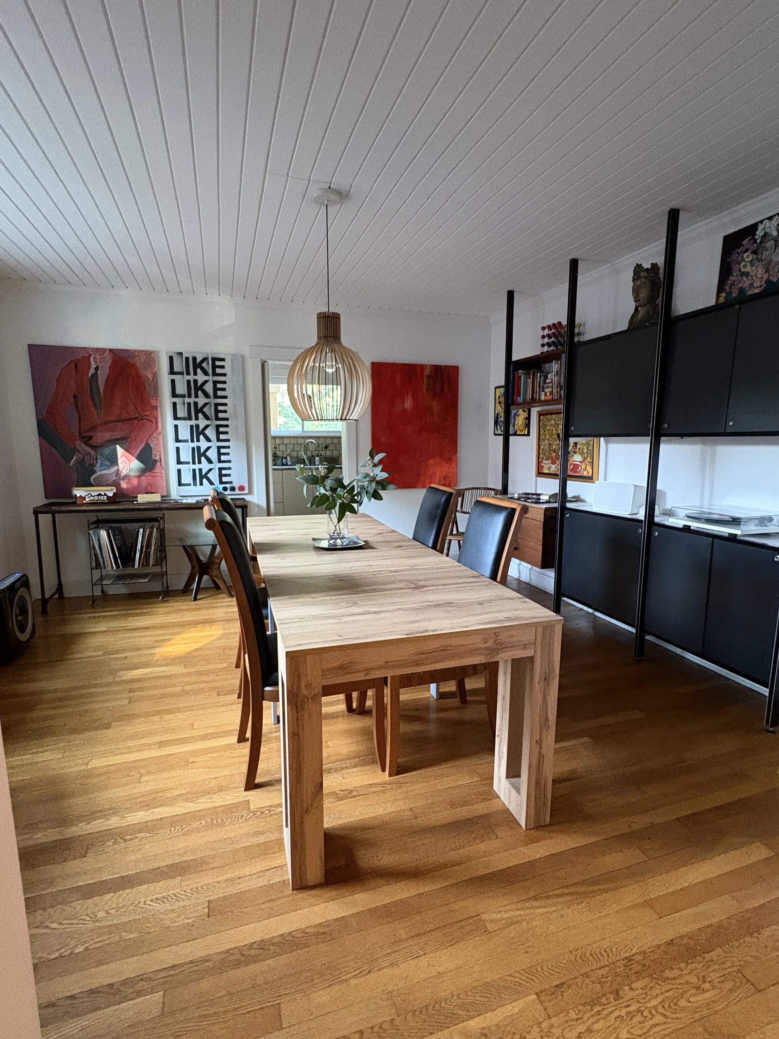 After: Pulling in both red paintings add much needed color, and the space feels elevated, and complete 