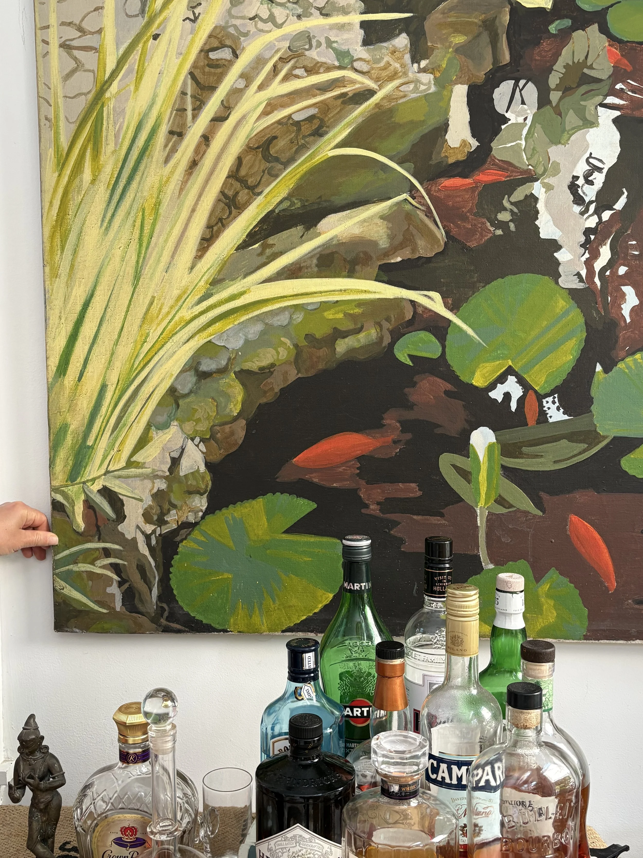 After: Found this beauty by the artist's mother down in the home gym. It looks perfect on this wall that transitions from the outdoor pool into the sunroom, and the colors blend beautifully with the bottles