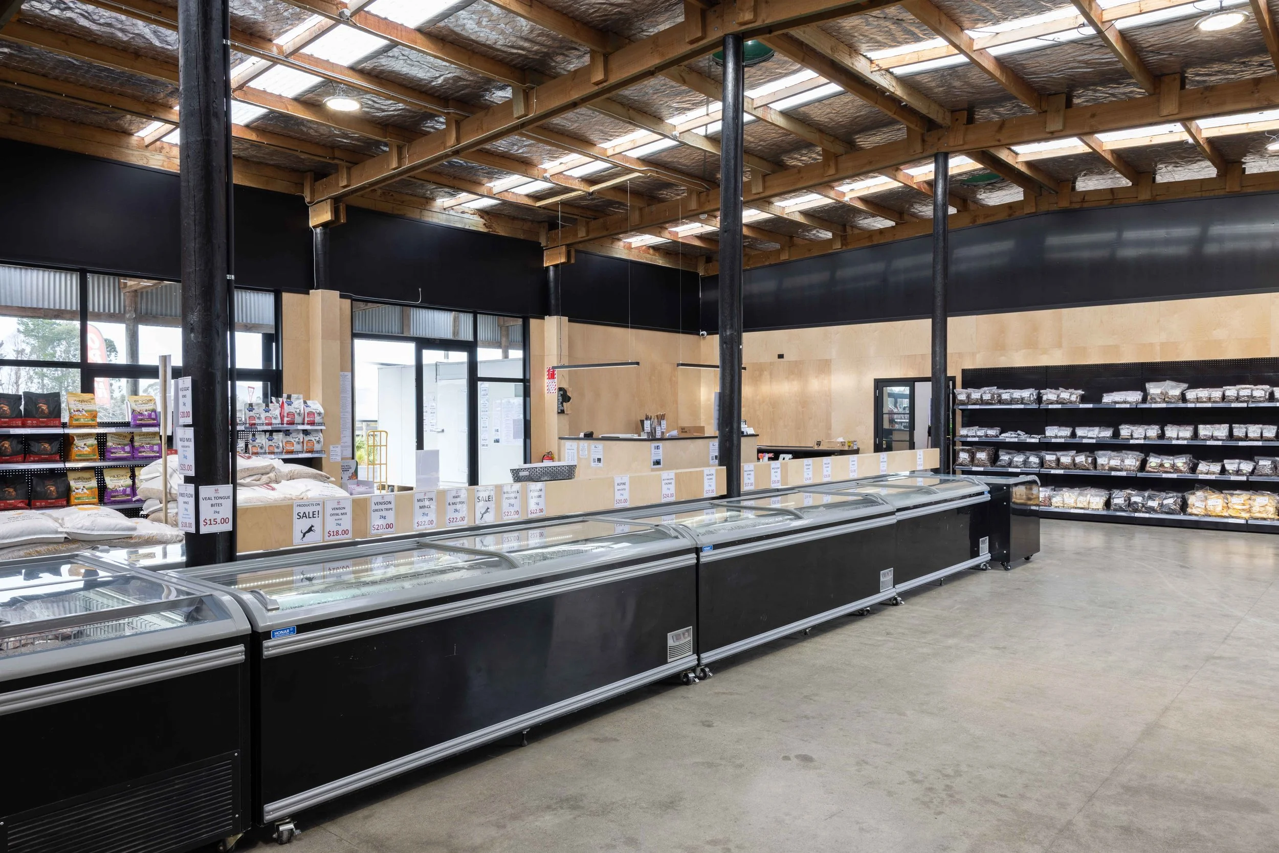 Inside K9 Pet Foods raw food store in Hastings with chest freezers and natural pet treats