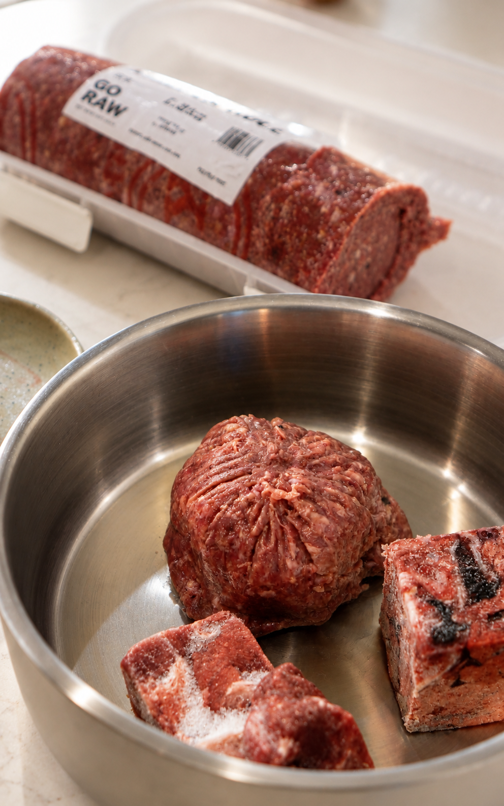 Portioned raw dog food in a bowl for the K9 Pet Foods raw feeding guide
