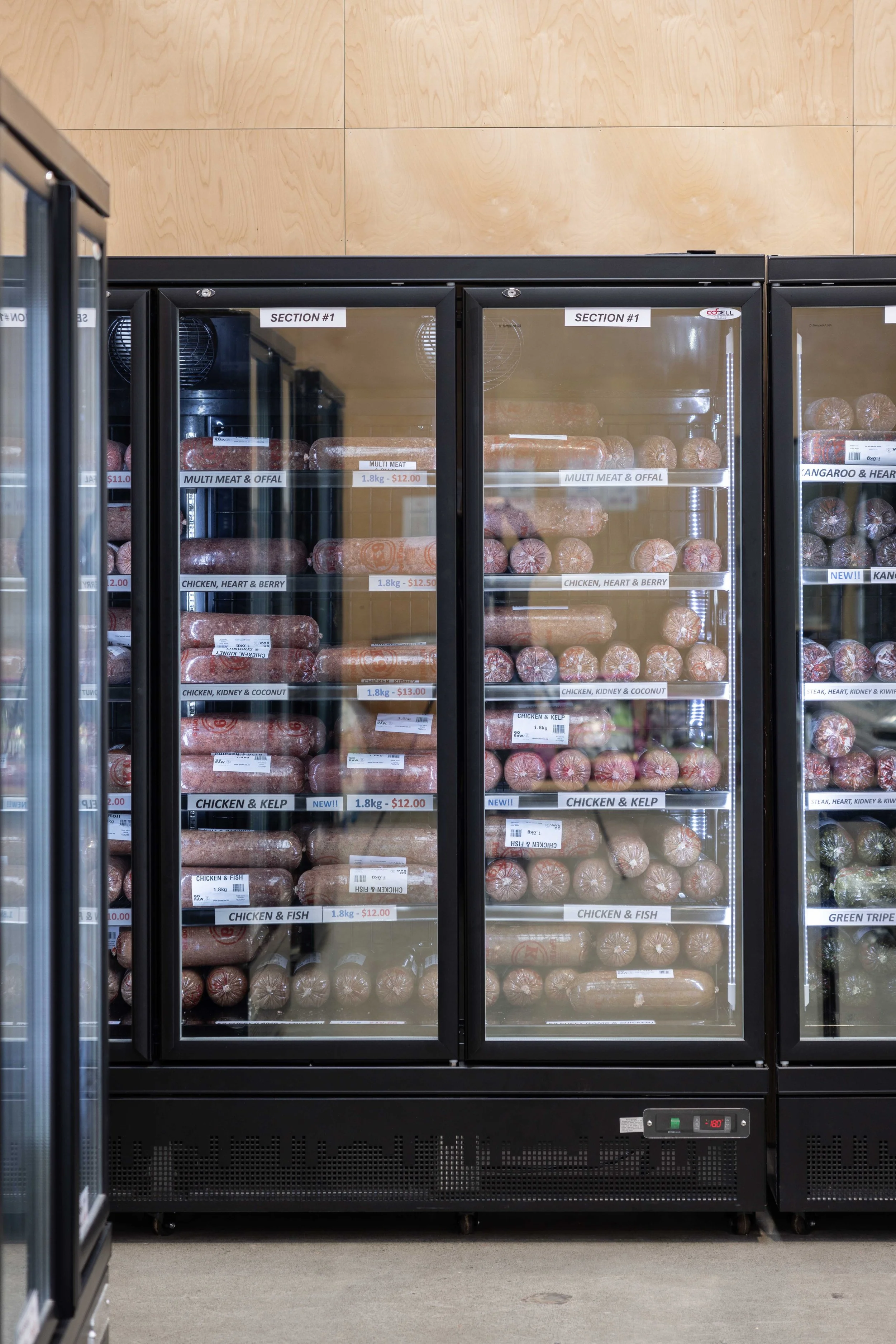 Raw pet food freezers inside K9 Pet Foods in Hastings