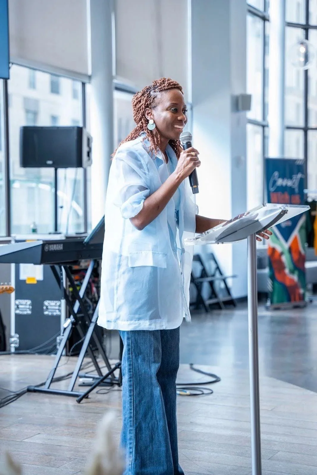 Pastor Bukky speaking on stage at the Ignite Church Whole Woman Conference.