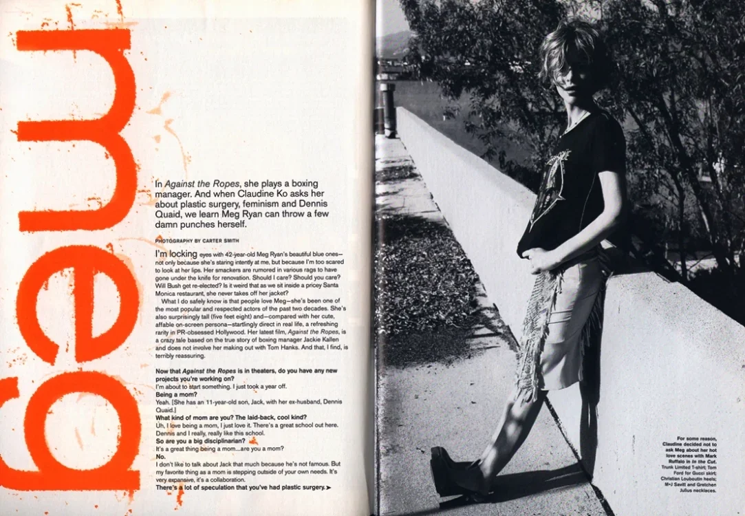 A black-and-white photograph of a young woman with shoulder-length hair standing outdoors on a sidewalk, with trees in the background. She is wearing a T-shirt, shorts, and sandals, looking off to the side.