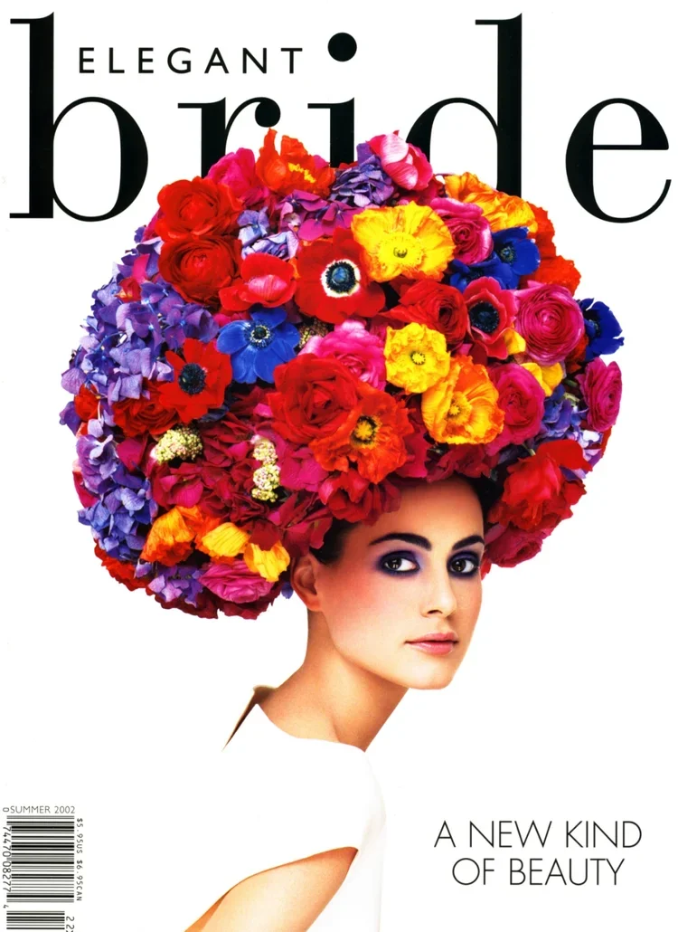 Cover of Vogue magazine featuring a woman with a large, colorful floral headpiece made of various flowers and the text "ELEGANT bride: A New Kind of Beauty."
