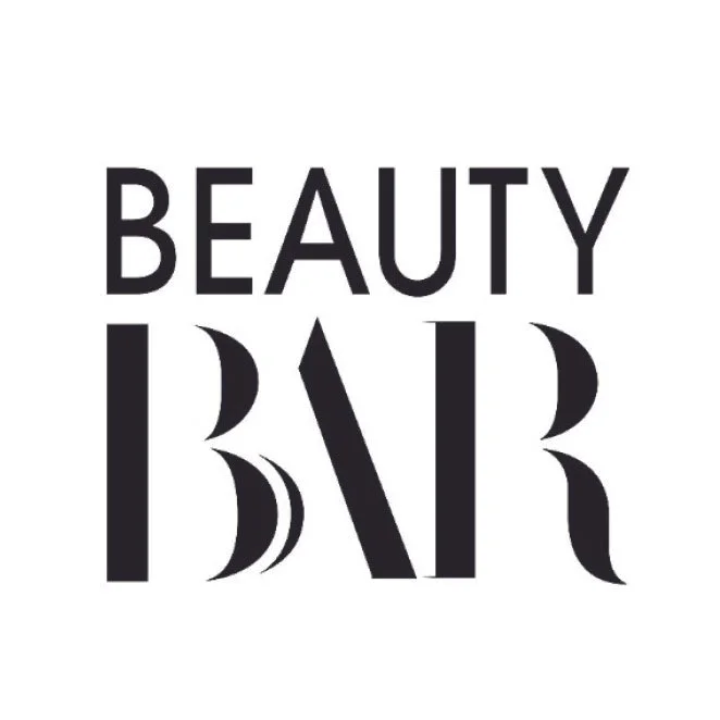 Black text on a white background reading "BEAUTY BAR" with a modern, stylized font.