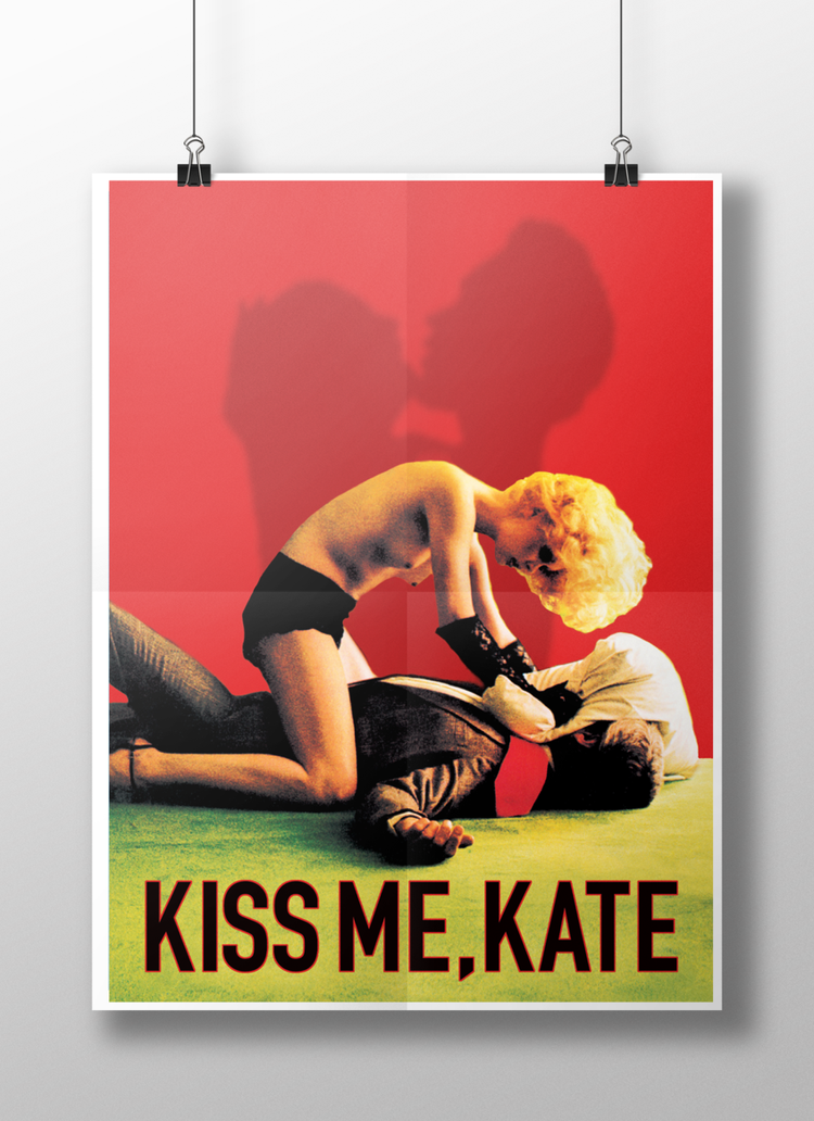 A poster featuring a woman with blonde curly hair in a provocative position on top of a man lying on the ground, with a red background and shadowed silhouettes of a couple kissing. The text at the bottom reads "KISS ME, KATE."