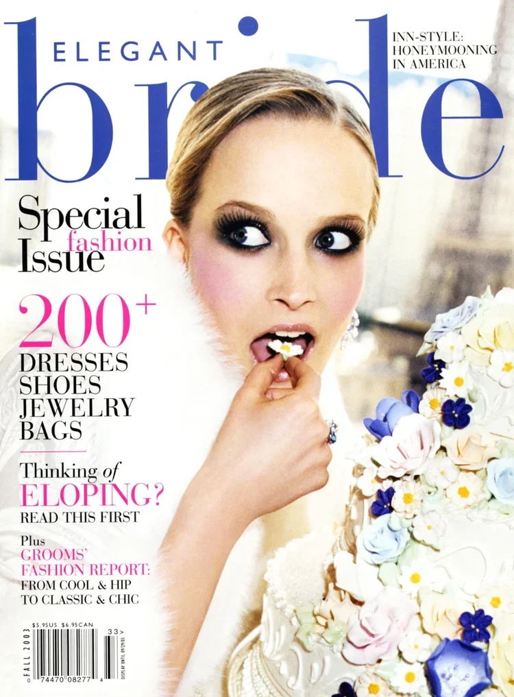 Cover of Elegant Bride magazine featuring a woman with styled hair and dramatic makeup, holding a finger to her lips near a wedding cake decorated with flowers, and text promoting fashion and wedding topics.
