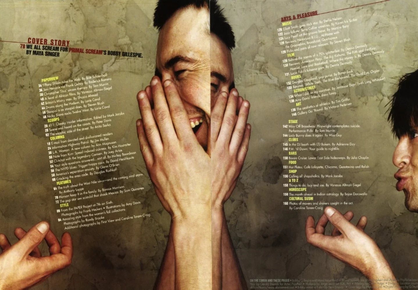 A person with dark hair is laughing and covering their mouth with both hands. The image includes parts of two other hands pointing or gesturing, and a blurred background. The left side of the image has a magazine or booklet page with sections of text
