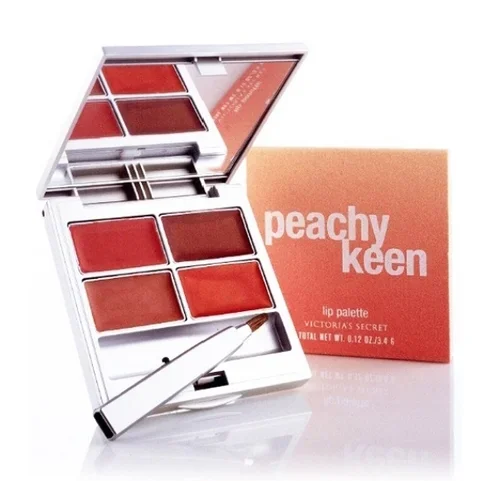 Open lip palette with four shades of peachy lipstick and a brush, alongside peachy keen lip palette box with white text.