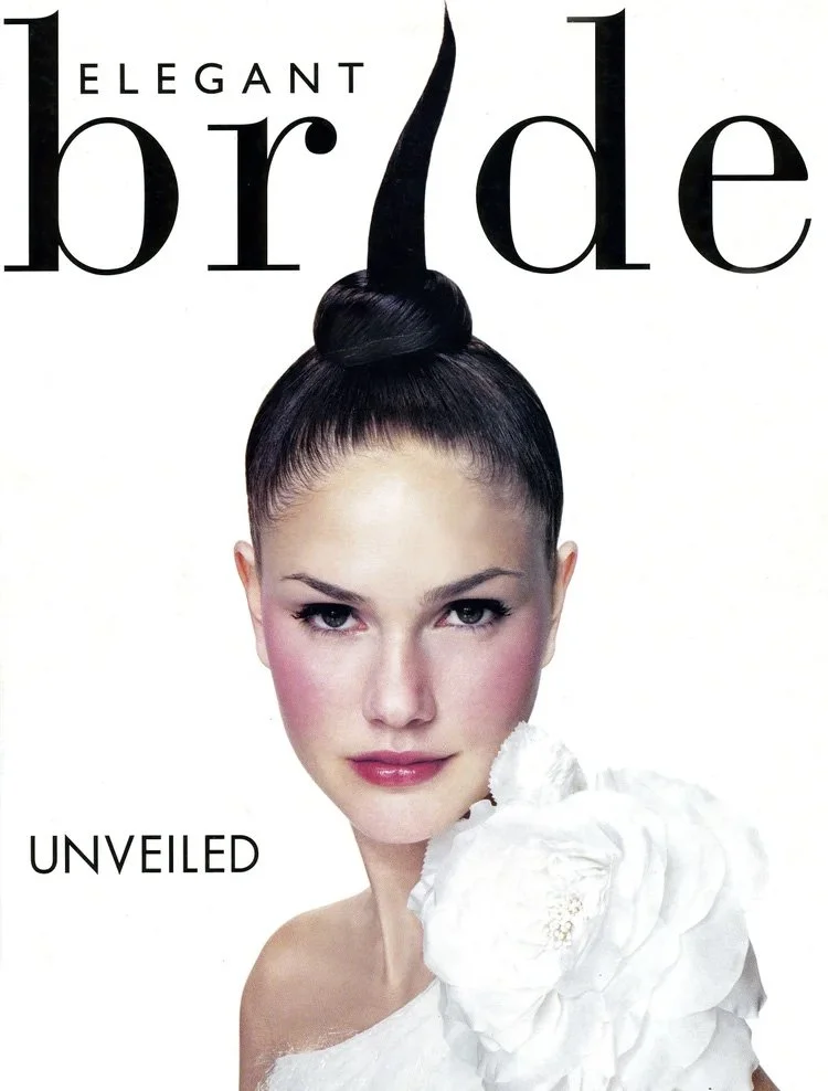 Magazine cover featuring a woman with her hair styled in a high bun and a prominent black hairpiece. The cover text says 'Elegant Bride' and 'Unveiled'.