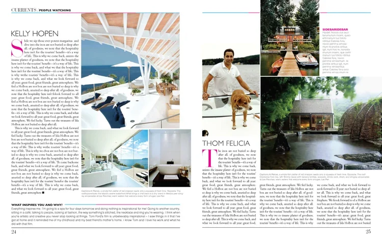 A luxurious outdoor patio with white beams, navy lounge chairs, a pool, and ocean view, creating a relaxing seaside atmosphere.