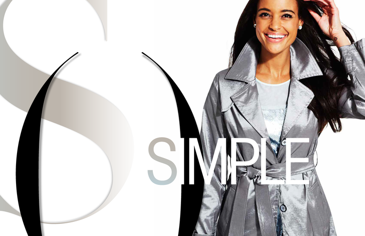 A smiling woman in a silver trench coat standing next to a large graphic design with the words "SIMPLE" and stylized letter "S" logo.